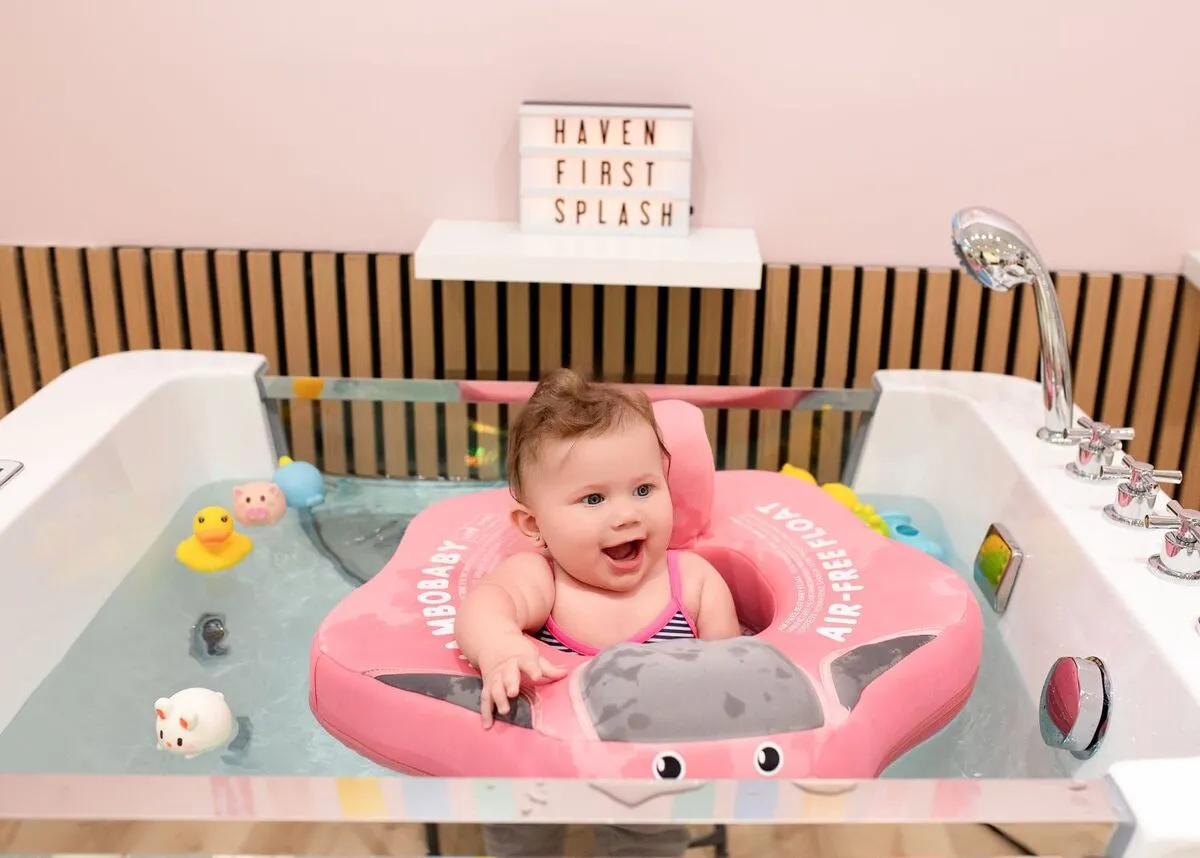 Happy baby in the float tub